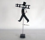 Glassfigur feier med stett